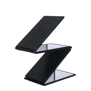 Portable four-way folding makeup mirror in black finish for 360-degree head viewing