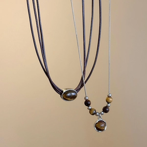 Tiger eye stone pendant necklace set with brown leather cord and silver chain style