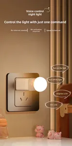 Close-up of a white voice-controlled USB night light plugged into a socket in use