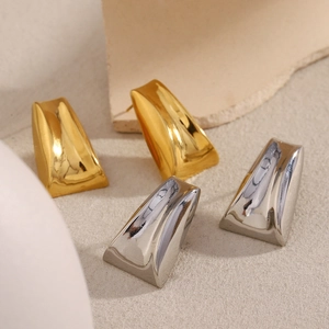 Detailed view of geometric trapezoid earrings in 18K gold and silver stainless steel
