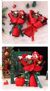 Detailed Christmas bouquet featuring Santa doll, pine cones, and Merry Christmas ribbons