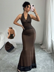 Detailed view of the dark brown V-neck halter dress with sheer mesh spliced mermaid hemline