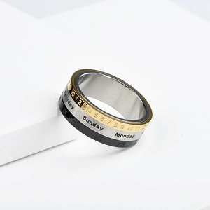 Rotatable stainless steel ring with gold, silver, and black calendar and Roman numerals