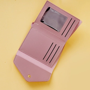 Detail view of the trifold lavender faux leather wallet with card slots and an ID window