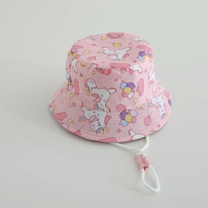 Detail of pink kids bucket hat featuring unicorn prints and adjustable windproof strap