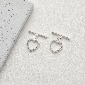 Close-up of heart-shaped toggle clasp with beaded texture for DIY jewelry making