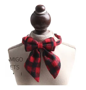 Detail of red and black buffalo plaid pet collar with long ribbon bowtie for cats and dogs