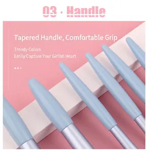 Set of 6 light blue makeup brushes with tapered handles on a pink background