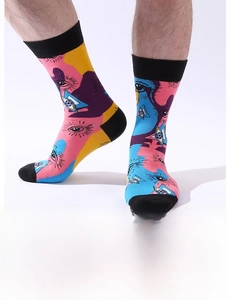 Detail of crew socks featuring vibrant graffiti eye patterns and color-blocking design