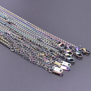Macro view of rainbow-colored 2.5mm stainless steel dragon bone chains and clasp