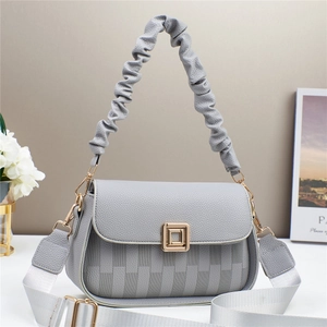 Grey litchi leather crossbody bag with pleated handle and golden buckle detail