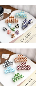 Detailed flat lay of checkered acetate hair claws in various sizes and vibrant colors