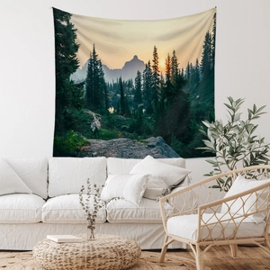 Detailed texture of forest landscape tapestry hanging over a modern white sofa