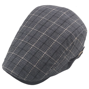 Close-up of grey plaid flat cap showing breathable fabric texture and side buckle