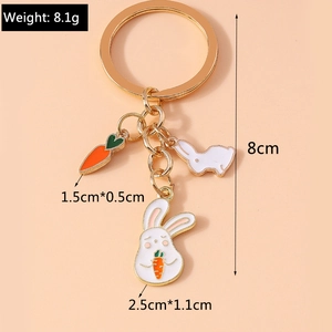 Detail view of rabbit enamel keychain with precise dimensions and weight on pink background