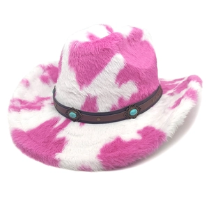 Pink and white cow print plush cowboy hat with turquoise western style leather band