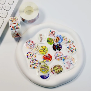 Roll of colorful Happy Birthday stickers for gift wrapping and festive decoration