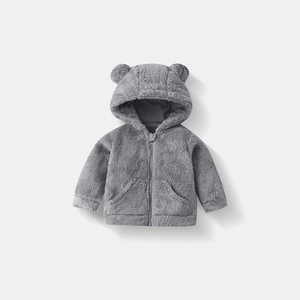 Detailed close-up of dark grey plush baby hoodie with cute bear ears and secure zipper