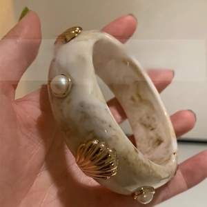 Resin bangle with marble pattern, gold shell accents and pearl beads for women