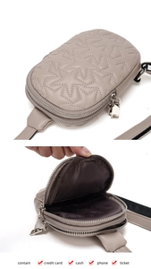 Detail view of beige quilted star pattern crossbody bag with dual zipper compartments