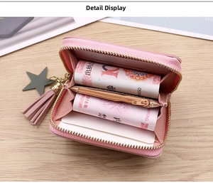 Pink mini coin purse interior showing multiple card slots and zipper pocket detail