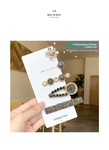 Detail view of five-piece rhinestone hair clip set with crystal flowers and gray beads