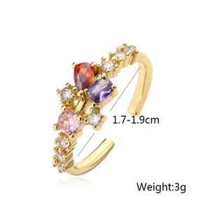 Detailed top view of gold-plated geometric open ring with colorful zircon stones
