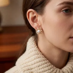 Elegant 18k gold plated pearl flower stud earrings with shimmering zircon petals