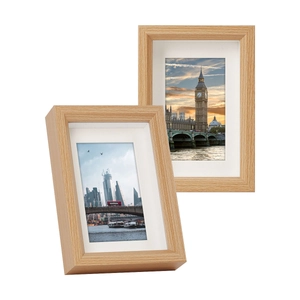 Minimalist light wood picture frame set with white matting displayed on white background