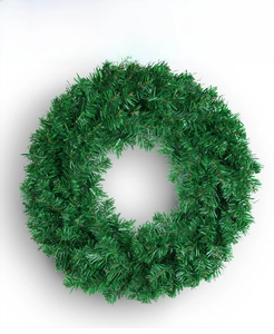 Close-up of green PVC artificial pine needle wreath for DIY Christmas decoration