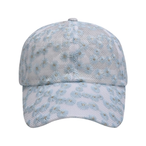 Detail of light blue mesh baseball cap featuring white daisy embroidery and floral lace