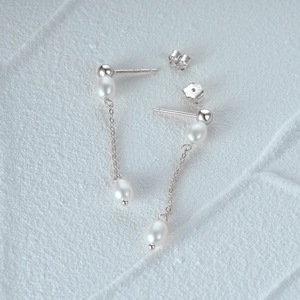 Detail shot of S925 sterling silver stamp on pearl long tassel chain earrings