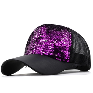 Detail of purple sequin front panel and black mesh back on a stylish baseball cap