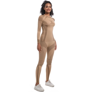 Detail of seamless knitted yoga set with functional compression textures in beige