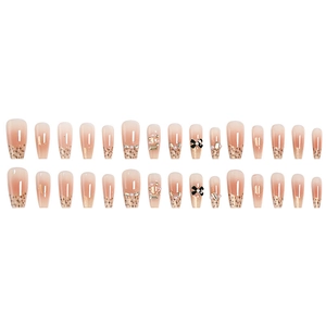 French style nude pink gradient press-on nails with black bows and pearl rhinestones
