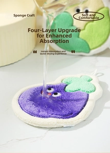 Macro shot demonstrating fast water absorption on a thick eggplant-shaped purple hand towel