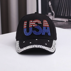 Close-up of USA letters in red white blue rhinestones on a black cotton baseball cap