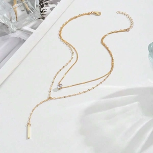 Elegant gold-tone double-layered Y-necklace with crystal pendant and long metal bar charm