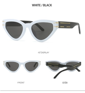 Detailed views of white cat eye sunglasses with black lenses and gold stripe temple accents
