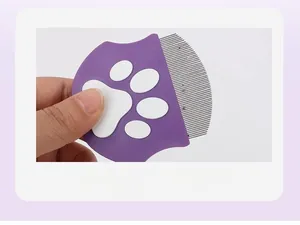 Close-up of cat claw grooming comb with fine stainless steel teeth for pet cleaning