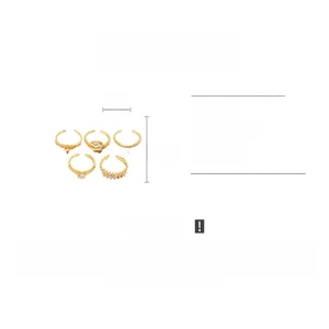 Detail view of 5-piece gold-tone ring set featuring zircon stones and copper alloy bands