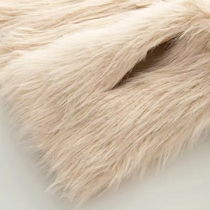 Women's beige faux fur baseball jacket featuring premium plush texture and long sleeves