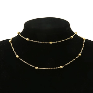 Detail view of 18k gold plated stainless steel double layer beaded chain on neck model