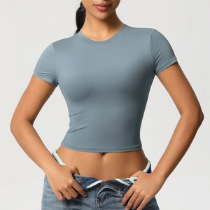 Close-up of a grey-blue tight-fitting yoga t-shirt showing matte stretch fabric texture