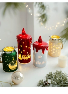 Close-up of festive LED Christmas candle lights in red and green with warm light