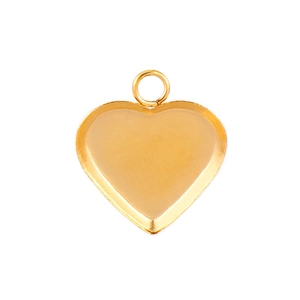 Macro view of gold heart-shaped stainless steel pendant tray for jewelry making