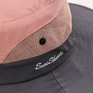 Detail of outdoor sun hat featuring pink plaid fabric and Sun Shade embroidery