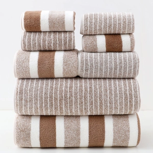 6-piece absorbent towel set in warm brown and beige, featuring soft terry fabric textures