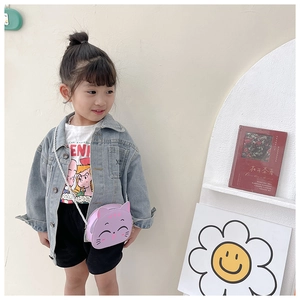 Close-up of cute purple cat-shaped children's PU shoulder bag worn by child model