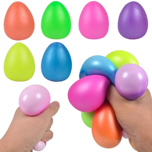 Close-up of colorful egg-shaped squishy toys being squeezed to show texture and elasticity